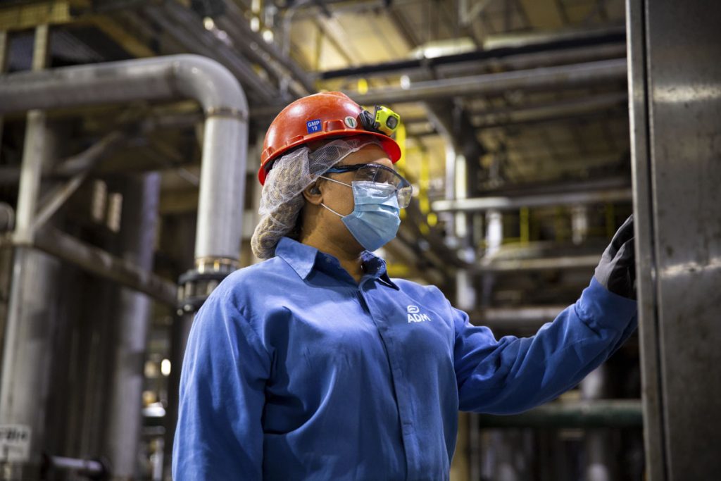 Woman operating a machine